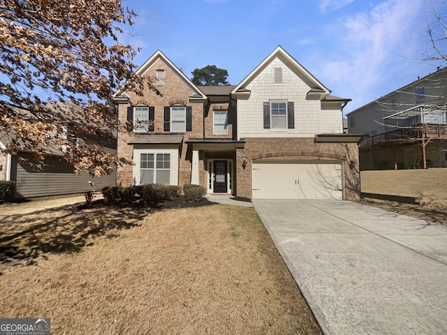 traditional-style home featuring a garage, brick siding, and driveway