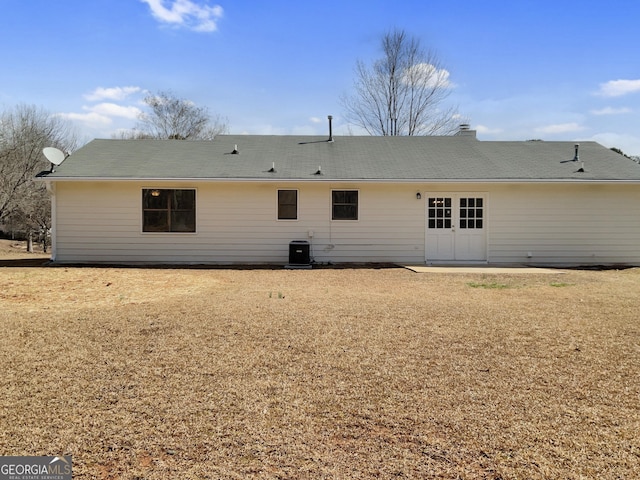 back of house featuring central AC