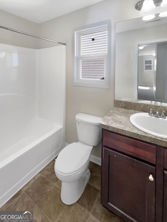 full bathroom with visible vents, toilet, tile patterned flooring, bathing tub / shower combination, and vanity