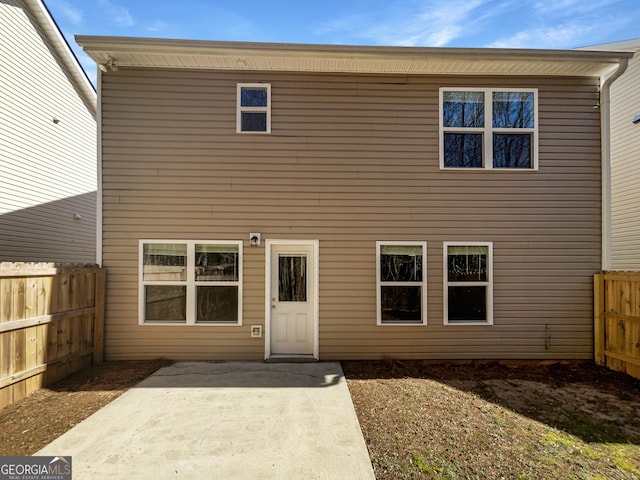 back of house featuring a patio and fence