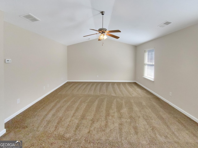 1181 Paramount Dr, Mcdonough, GA 30253 - carpeted spare room featuring vaulted ceiling and a ceiling fan