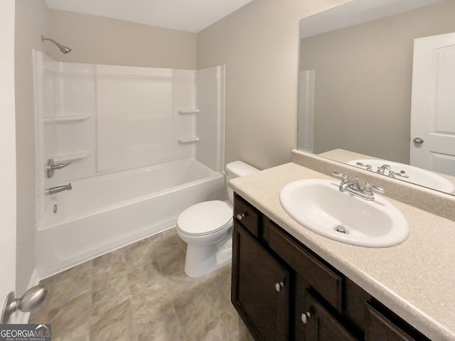 bathroom with washtub / shower combination, toilet, and vanity