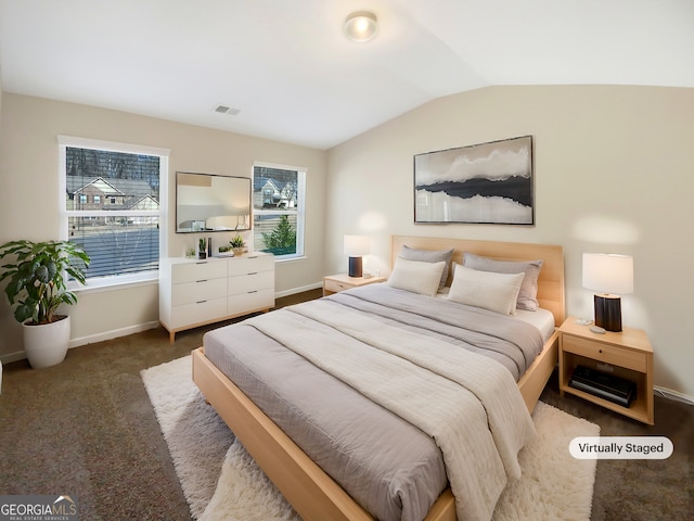 carpeted bedroom featuring baseboards, lofted ceiling, and visible vents