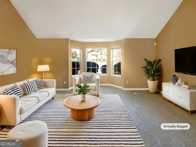 carpeted living area with baseboards and vaulted ceiling