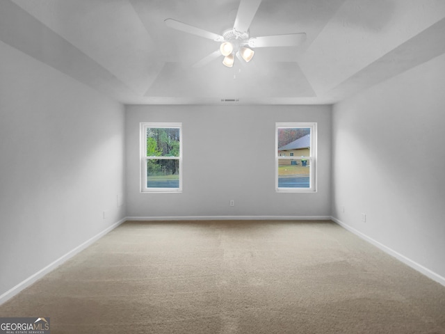 unfurnished room featuring visible vents, ceiling fan, baseboards, and carpet floors