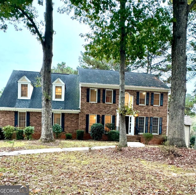 view of front of house with brick siding