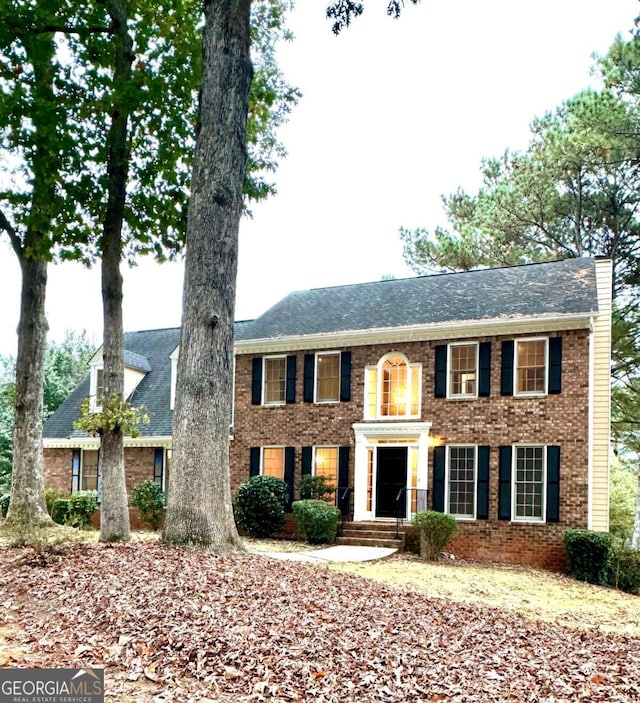 view of front of house featuring brick siding