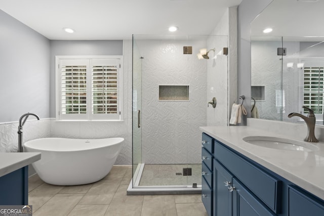 full bath with vanity, recessed lighting, a stall shower, and tile patterned flooring