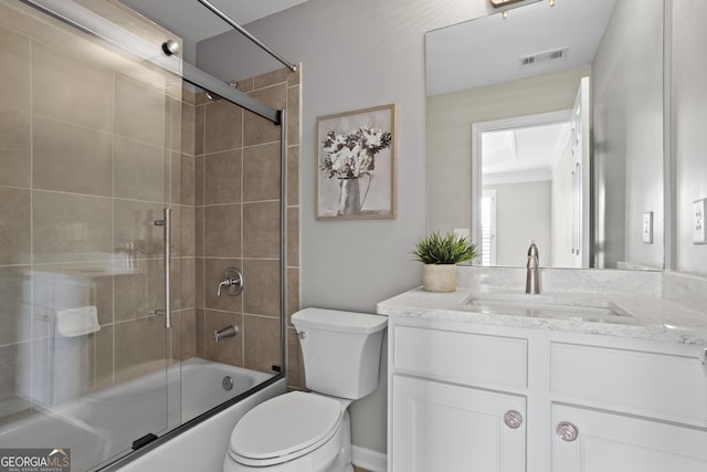 full bathroom with vanity, toilet, visible vents, and combined bath / shower with glass door