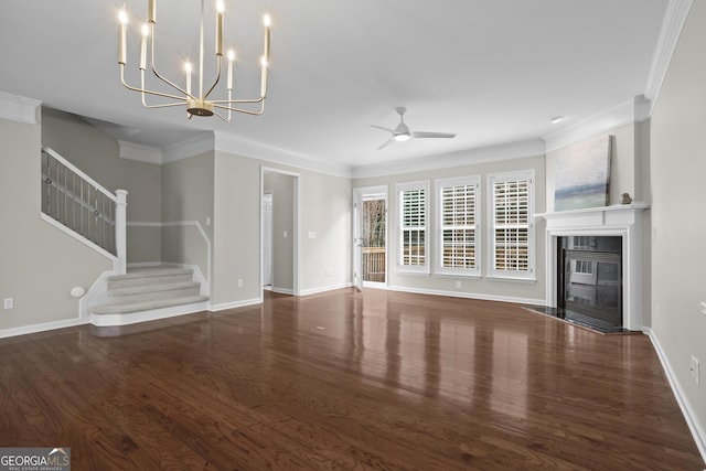 unfurnished living room featuring wood finished floors, a ceiling fan, a fireplace, stairs, and crown molding