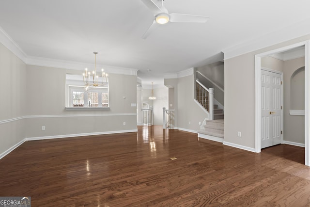 unfurnished living room featuring ceiling fan with notable chandelier, wood finished floors, stairway, crown molding, and baseboards