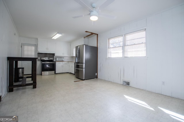 kitchen with light floors, visible vents, ceiling fan, appliances with stainless steel finishes, and white cabinetry