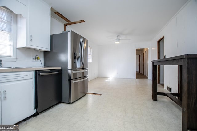 kitchen featuring visible vents, appliances with stainless steel finishes, white cabinets, light countertops, and light floors