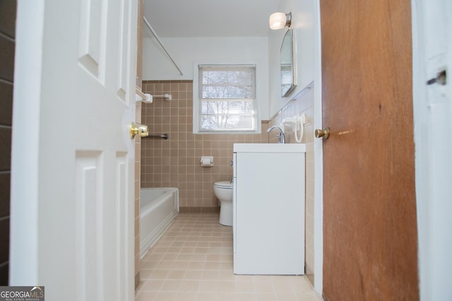 bathroom featuring vanity,  shower combination, tile walls, toilet, and tile patterned floors