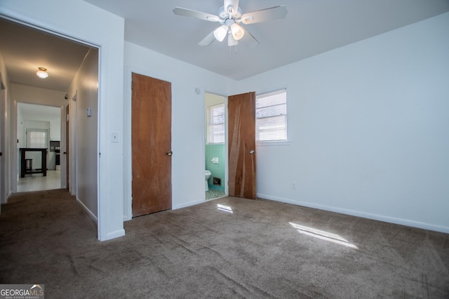 unfurnished bedroom with carpet flooring, baseboards, and ceiling fan