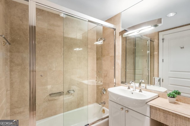 full bathroom with vanity and shower / bath combination with glass door