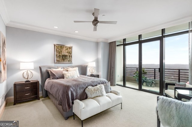 bedroom with access to exterior, floor to ceiling windows, light colored carpet, and crown molding