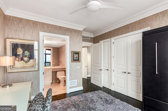 bedroom featuring visible vents, wallpapered walls, and ornamental molding