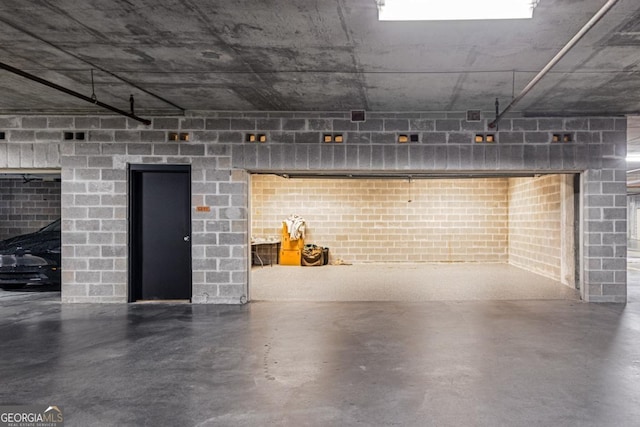 parking garage featuring concrete block wall