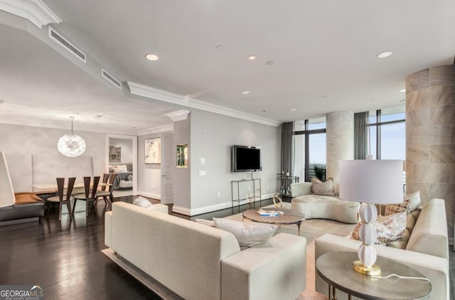 living area featuring baseboards, visible vents, dark wood-style flooring, and ornamental molding