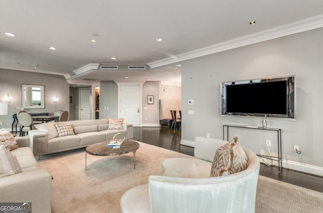 living area featuring recessed lighting, baseboards, and ornamental molding