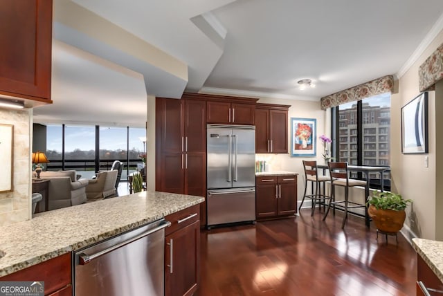 2660 Peachtree Rd NW Unit 14D, Atlanta, GA 30305 - kitchen with stainless steel appliances, dark wood finished floors, crown molding, light stone counters, and decorative backsplash