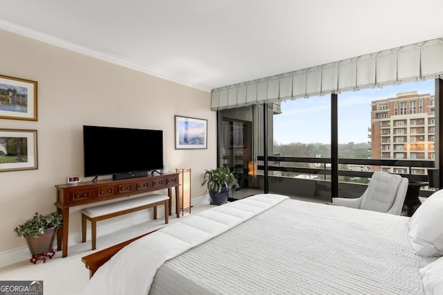 2660 Peachtree Rd NW Unit 14D, Atlanta, GA 30305 - carpeted bedroom featuring baseboards and ornamental molding