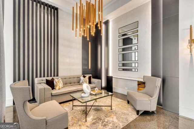 living room with a high ceiling and granite finish floor