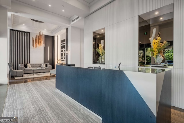 2660 Peachtree Rd NW Unit 14D, Atlanta, GA 30305 - reception featuring crown molding, recessed lighting, and a towering ceiling
