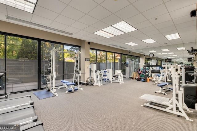 workout area featuring a drop ceiling