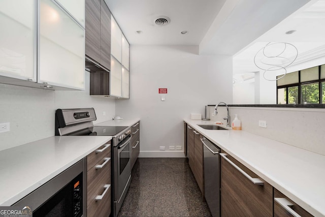 2660 Peachtree Rd NW Unit 14D, Atlanta, GA 30305 - kitchen with a sink, appliances with stainless steel finishes, granite floors, baseboards, and light countertops