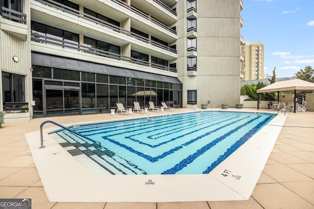 pool with a patio area