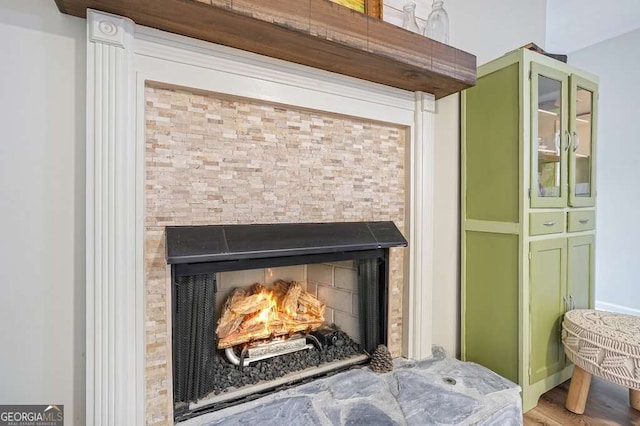 room details with a lit fireplace