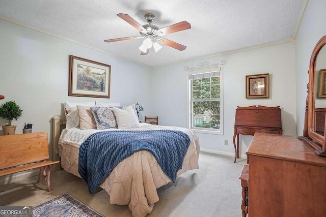 bedroom featuring crown molding, baseboards, light colored carpet, a textured ceiling, and a ceiling fan