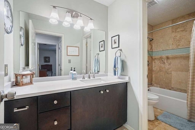 full bathroom featuring vanity, washtub / shower combination, visible vents, a textured ceiling, and toilet