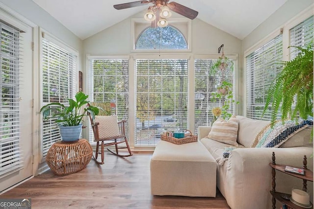 sunroom / solarium with plenty of natural light, ceiling fan, and vaulted ceiling