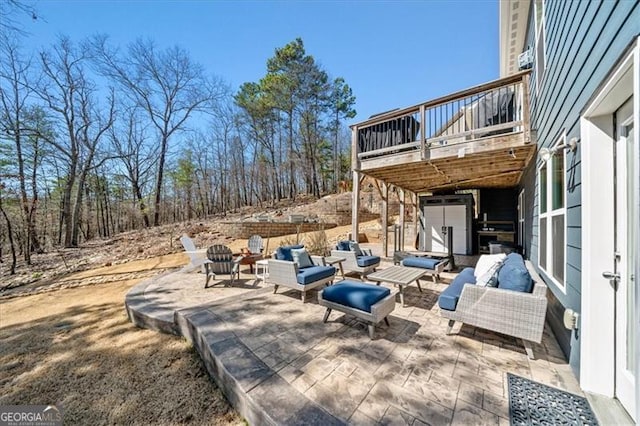 view of patio / terrace with an outdoor hangout area and a wooden deck