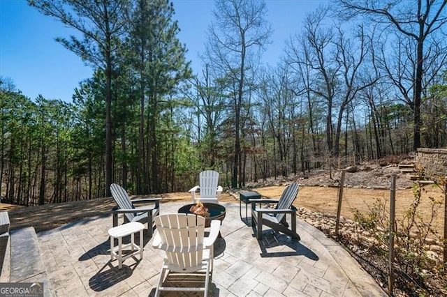 view of patio with an outdoor fire pit