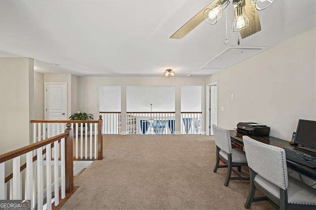 carpeted office featuring a ceiling fan