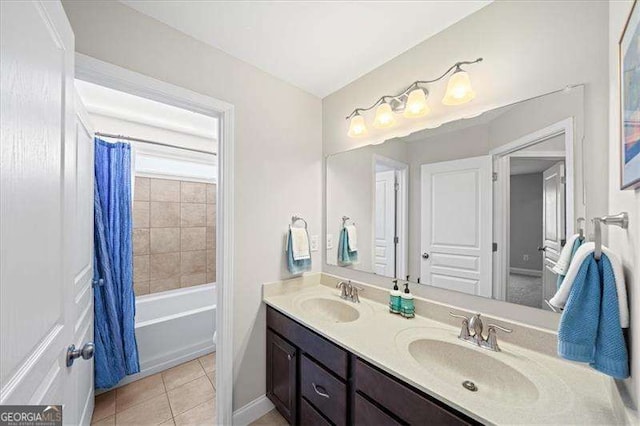 full bath featuring tile patterned floors, double vanity, shower / bathtub combination with curtain, and a sink