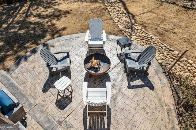 view of patio / terrace featuring a fire pit