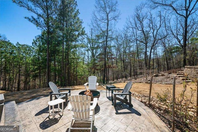 view of patio featuring an outdoor fire pit