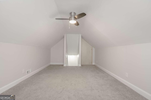 bonus room featuring visible vents, baseboards, lofted ceiling, and carpet