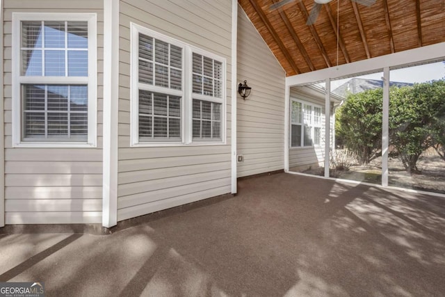 unfurnished sunroom with lofted ceiling and wood ceiling