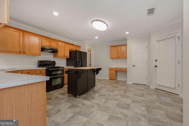 kitchen with visible vents, black appliances, under cabinet range hood, ornamental molding, and built in study area