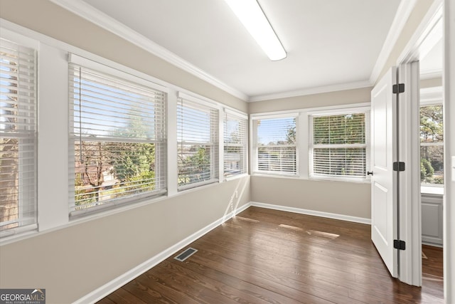 unfurnished sunroom with visible vents and a healthy amount of sunlight