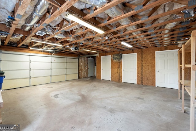 garage with visible vents and a garage door opener