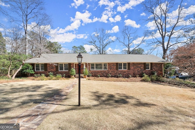 ranch-style house with brick siding and driveway