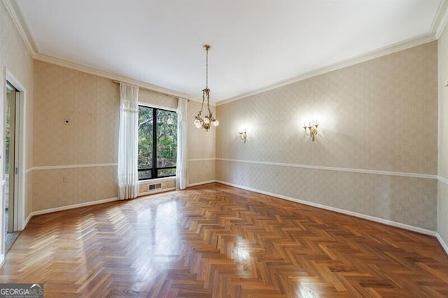 unfurnished room featuring baseboards, a chandelier, crown molding, and wallpapered walls