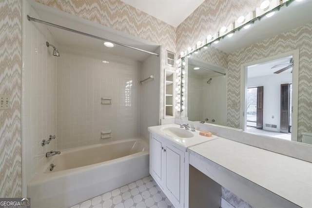 full bath with tile patterned floors, visible vents, shower / tub combination, wallpapered walls, and vanity